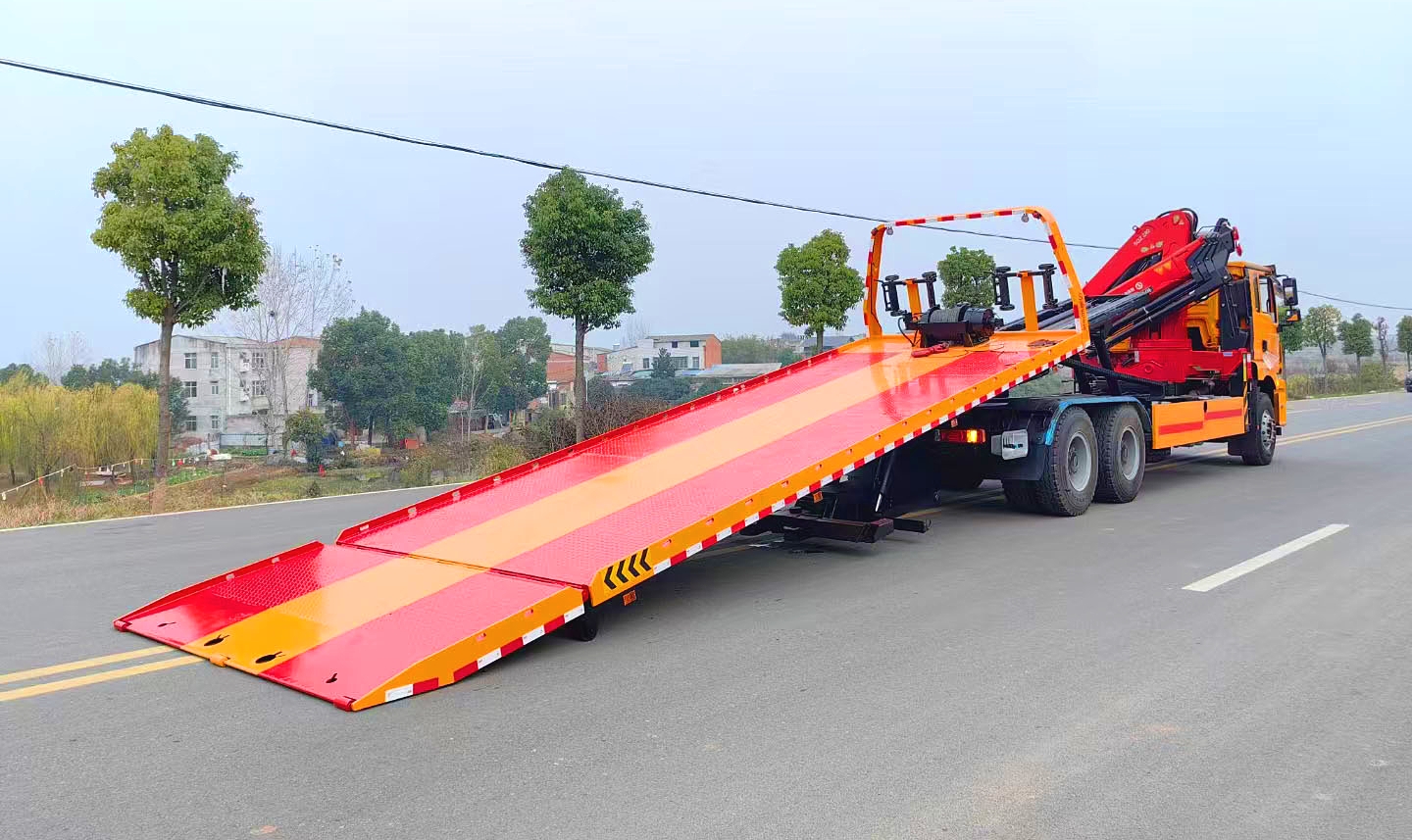 Tow truck with crane